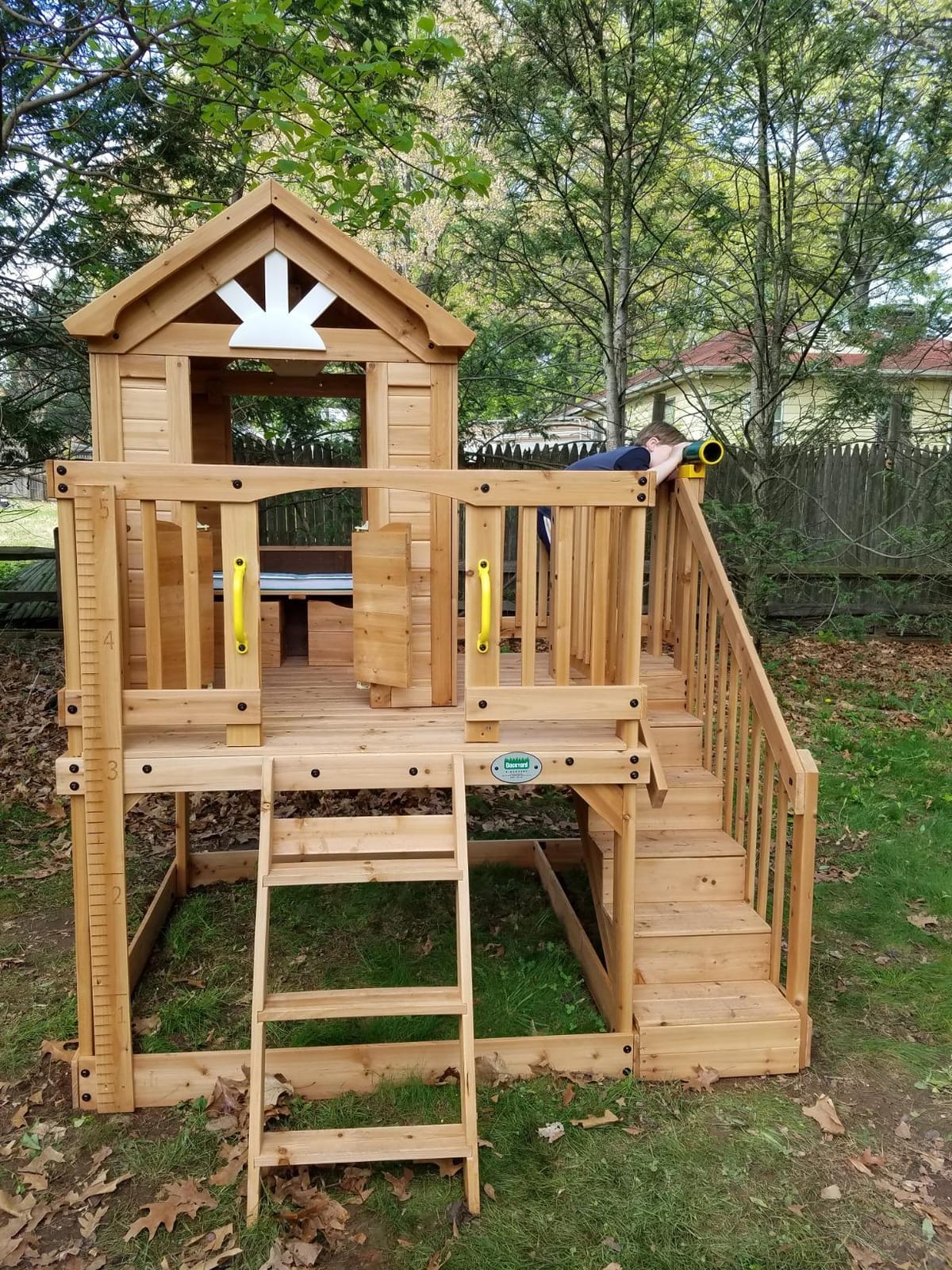 Backyard Discovery Scenic Heights Elevated Cedar Wooden Kids Playhouse with Play Kitchen, Wrap-Around Deck, Toy Storage Bench, Saloon-Style Doors, Ladder, Stairs, and Growth Chart for Outdoor Play customer photo 2