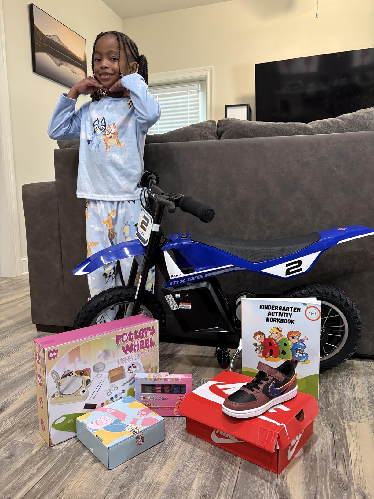 Razor MX125 Dirt Rocket Electric-Powered Bike with Authentic Motocross Geometry, Rear-Wheel Drive,100-watt, high-Torque, Chain-Driven Motor, for Kids 7+, Blue | Iconic Wheeled Ride-On For Kids Age 5+ | Hi/Lo Speed Safety Switch | 100W/12V Motor | Up To 8 MPH, 40 Mins; 78 Lbs customer photo 2