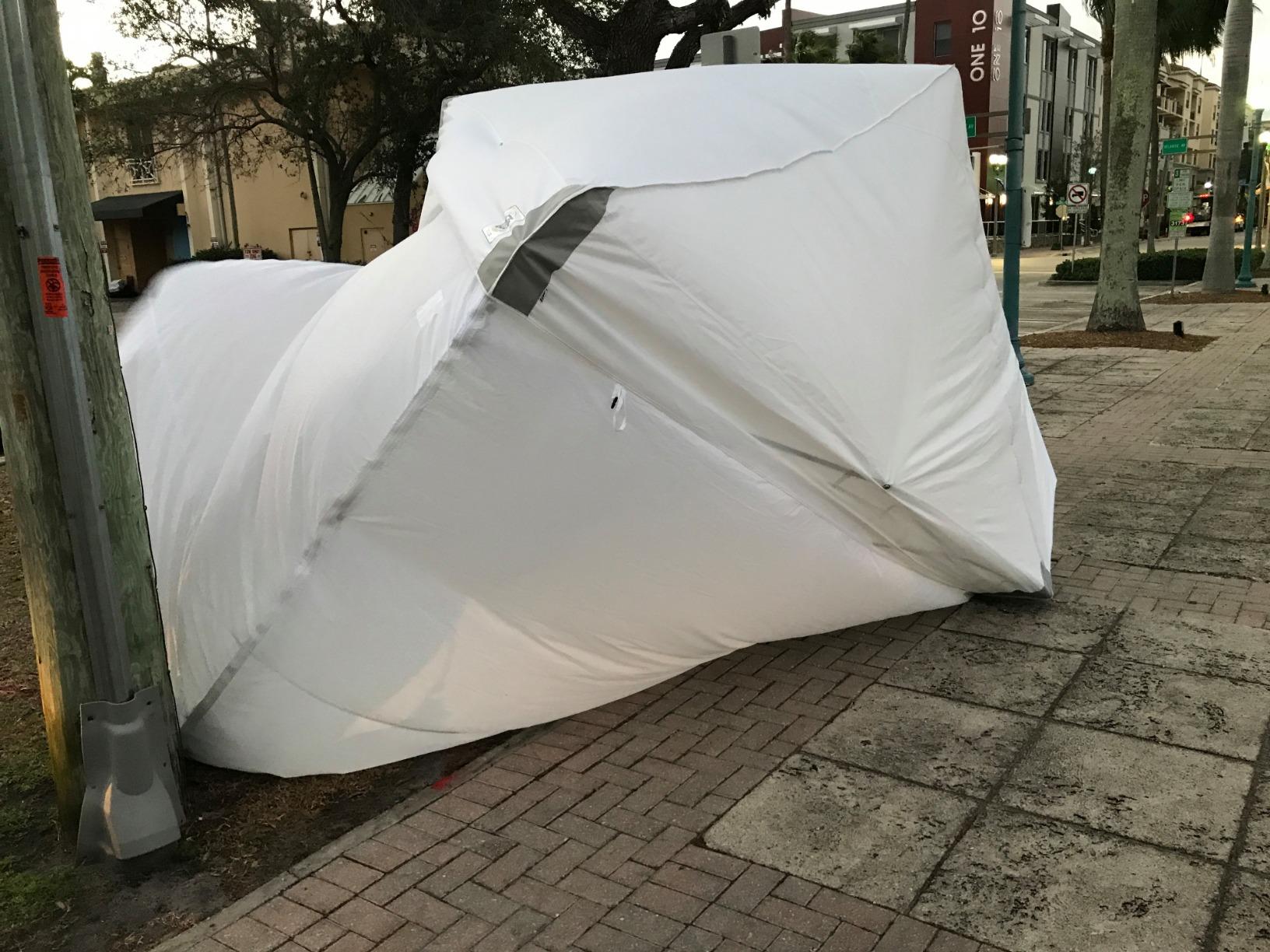 E-Z UP ES100S Instant Commercial Pop Up Canopy Tent, 10' x 10' with 3 Sidewalls, 1 Mid-Zip Sidewall and Wide-Trax Roller Bag, White customer photo 1